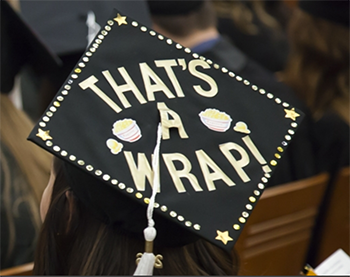 A cap at a commencement ceremony that reads "That's a wrap!," Communication Arts tile