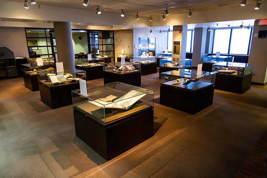 Well-lit room with glass display cases